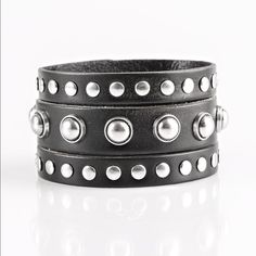 Win Your Spurs - Black Round And Flat Silver Studs Are Studded Across The Front Of A Thick Black Leather Band That Has Been Spliced Into Three Bands. Features An Adjustable Snap Closure. Sold As One Individual Bracelet. Black Studded Bracelets For Party, Party Leather Bracelet With Rivets, Edgy Leather Bracelet For Party, Silver Leather Bracelet With Rivets For Concerts, Edgy Silver Leather Bracelet With Studs, Silver Leather Bracelet With Rivets For Party, Punk Black Bracelet With Silver Studs, Silver Bracelets With Rivets For Concerts, Edgy Silver Bracelet With Black Band