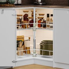 an open cabinet in the corner of a kitchen