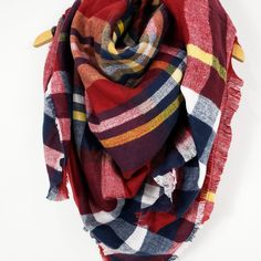 PRETTY PLAID || SCARF LOVE Tartan plaid scarf with red, blue, yellow, and white colored shades Super soft, knit, medium weight fabric Raw fringe edge Available in 6 colors 100% Acrylic Measurements approximately 57" X 57" Machine wash cold gentle cycle, hang to dry, or dry clean Fall Plaid Shawl Scarf, Plaid Shawl Scarf For Fall, Cotton Shawl Scarves For Fall, Red Shawl Scarves For Fall, Red Casual Scarves For Fall, Casual Red Scarf For Fall, Tartan Plaid Scarf, Plaid Blanket Scarf, Plaid Blanket