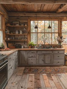 a rustic kitchen with wooden floors and walls