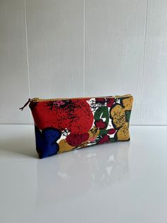 - Measures 10" x 4" - I have handmade this zipper pouch out of a heavy weight vintage 1960's home decor cotton. - The interior is a red cotton and has been lined with interfacing. - Zipper has an added leather pull. 1960s Home Decor, Vintage Floral Fabric, Tampa Fl, Toiletry Storage, Pencil Pouch, Leather Pulls, Cosmetic Bags, Floral Fabric, Heavy Weight