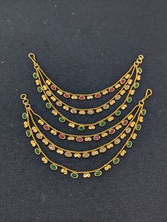 Please allow some variation in color. Triple layer Earring chain. Polki stone pasted Bridal kaan chain. Base material is made of copper alloy with gold plating. Ear Chain for Indian Earrings. Comes as a pair.  Length: 6.85 inches. Maatal / Kaan chain / Champasaralu. Gold Fusion Earrings With Stones, Traditional Gold Jewelry With Stones, Fusion Style Dangle Jewelry With Tilla, Fusion Style Jeweled Dangle Jewelry, Fusion Jeweled Dangle Jewelry, Gold Jeweled Fusion Danglers, Gold Fusion Jeweled Danglers, Traditional Jewelry With Adjustable Chain, Gold Earrings With Stones For Festive Occasions