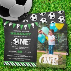 a soccer themed birthday party with a photo and balloons on the grass next to a ball