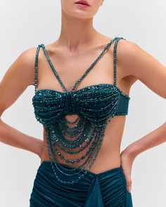 The Hand-Beaded Bralette was part of the Fall 2024 Runway Collection. Crafted from a tulle fabric, this bralette is fully beaded with green tonal beads and features a dramatic hand-beaded drape detail. The straps are beaded and adjustable. Back clasp closure.Made in Brazil. TOP30393US. Beads Bra, Beaded Bralette, Bra Art, Bead Bra, Crystal Bra, 2024 Runway, Diy Wings, Bra Outfit, Diy Clothes Design