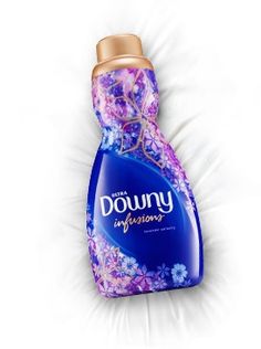 a bottle of downy deodorant on a white background