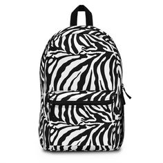 Its time to get ready for heading back to school your child will want to stand out with this Zebra Print Backpack! This backpack is perfect for anyone who loves animals. This backpack is sure to be a one of a kind. Our backpacks are roomy and durable backpack, made from 100% spun polyester and weighs just 1.3 lbs. Backpack dimensions are approximately 18.11in tall, 11.81in wide and 5.12in deep. The backpack is light, strong and long-lasting, water resistant with adjustable shoulder straps.  A total of 4 compartments - 1 main zip pocket, 1 front pocket, bottle pocket on the side and inside compartment for a laptop or tablet. Whether you're shopping for a special gift or just want to provide a comfortable and stylish backpack, this backpack is the perfect choice. Order yours today! **Also lo Casual Backpack With Animal Design For Back To School, Back To School Backpack With Animal Design, Casual Standard Backpack With Animal Design, Student Backpack With Animal Design For Back To School, Back To School Backpack With Animal Design For Students, Casual Backpack With Animal Design, Back To School Student Backpack With Animal Design, Back To School Animal Design Standard Backpack, Animal Design School Backpack