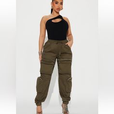 Brand New Stretchy Olive Green Olive Green Cargo Outfits Women, Green Cargo Outfits Women, Baggies Outfit, Olive Green Cargo Pants Outfit, Baggie Pants, Cargo Outfits Women, Turquoise Jumpsuit, Green Cargo Pants Outfit, Black Sequin Jumpsuit