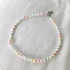 Cute Rainbow Seed Beads and Plastic Pearls Small Stretchy String Choker Necklace Measurements: 14 inches-18 inches (using all the chain) Pearls Choker, Necklace Measurements, Cute Rainbow, Pearl Choker Necklace, Beaded Choker Necklace, Pearl Choker, Beaded Choker, Beaded Jewelry Diy, Jewelry Diy