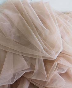 Specification: Colour: Ivory/White/Navy blue/Light gray/Dark gray/Light champagne/Champagne/Dark champagne/Dark pink/Royal blue Composition : Polyester Length : Sell per meter Width : 150 cm / 59 inches Price is per running meter, i.e for the purchase of one unit you will receive 1meter x 1.5 meter tulle. The width is fixed. If you buy 2 we will send you 2 meters X 1.5 meters. This is a superfine high end tulle，It is very delicate and feels super soft. It's perfect for veils and very soft weddin Luxury Pink Fitted Tulle Fabric, Cream Tulle Bridesmaid Dress, Cream Tulle Bridesmaid Wedding Dress, Cream Embroidered Tulle Fabric, Sheer Cream Tulle Fabric, Tule Fabric, Soft Wedding Dresses, Fashion Display, Custom Corsets