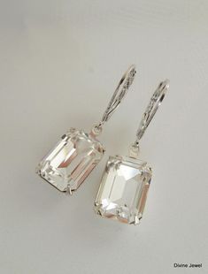 "These romantic earrings have Swarovski emerald cut crystal rhinestones. Lever back ear wires are rhodium finish. Earrings are approximately 1 1/2\" long. Crystal measures 1/2\" by just over 3/8\" at its widest point. Rhinestones have prong set settings. Elegant, classic for any occasion! Please take a look at the rest of the ARIA COLLECTION! http://www.etsy.com/shop/DivineJewel/search?search_query=aria&search_submit=&search_type=user_shop_ttt_id_5851541&shopname=DivineJewel Original Elegant Emerald Cut Earrings For Wedding, Elegant Emerald Cut Wedding Earrings, Wedding Earrings Emerald Cut With Prong Setting, Emerald Cut Earrings With Prong Setting For Wedding, Emerald Cut Wedding Earrings, Long Crystal Earrings, Teardrop Bridal Earrings, Long Bridal Earrings, Bridal Earrings Studs