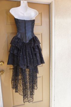 "Vintage small size P black dress with leather sweetheart bodice and ruffle lace layered skirt. Zips up the back. In great vintage condition! Measurements taken across front laid flat 15\" across front armpit to armpit 12\" across front of waist -doubles to 24\" 17\" across front of hips 27\" length armpit to bottm" Criss Cross Bathing Suit, Silk Nightgown, Lace Layers, Red Tank, Small Black Dress, Full Circle Skirts, Layered Skirt, Black Trim, Night Gown