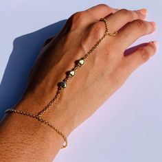 "18 Karat Gold Filled Heart Hand Chain Bracelet length: 7\" + 1.5\" Extension Finger Loop: 4\"  Material: 18 Karat Gold Filled, Hypoallergenic. Tarnish Resistant. Gold-filled does not de-laminate or peel like Gold plated Jewelry nor does it tarnish as readily as silver. Generally speaking, gold filled is better quality and will have a much longer lasting color than plated jewelry. Gold filled jewelry is an excellent option for those who wish to have a product of exceptional quality, beautiful and anti-allergenic, but with prices far lower than solid gold jewelry. We recommend keeping abrasive chemicals away from the jewelry for the items to last. Thank you for visiting and supporting our small business! We hope you will find a stylish piece that speaks to you! ♥ All of our piece our carefu Gold Heart Bracelet For Valentine's Day Party, Gold Heart Beads Bracelet For Party, Adjustable Chain Bracelet For Valentine's Day Party, Adjustable Chain Bracelet For Party On Valentine's Day, Adjustable Chain Bracelet For Party, Valentine's Day, Adjustable Metal Jewelry For Promise, Gold Heart Bracelet For Party, Personalized Adjustable Metal Chain Bracelet, Heart Beads Bracelet Jewelry For Party