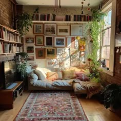 a living room filled with furniture and lots of books on the shelves above it's windows