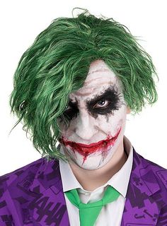 a man dressed as the joker with green hair