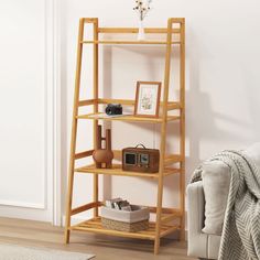 a living room with a couch, chair and shelving unit