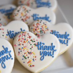 decorated heart shaped cookies with thank you written on them