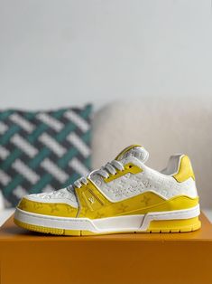 Embrace a bold and energetic style with these LV Trainer-inspired sneakers. The vibrant yellow hue commands attention, while the iconic Louis Vuitton monogram pattern subtly adorns the upper, adding a touch of luxury. Crafted with meticulous attention to detail and premium materials, these sneakers deliver a comfortable and stylish experience, perfect for those seeking a statement piece that seamlessly blends streetwear edge with high-fashion inspiration. Louis Vuitton Trainer, Louis Vuitton Trainers, New Taiwan Dollar, Monogram Pattern, Loafer Sneakers, Lv Monogram, Bottega Veneta Shoulder Bag, Trainer Sneakers, White Trainers