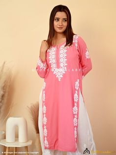 Peach Handmade Chikankari Straight Kurti, Chikankari Kurta for Women, Lucknowi Chikan Dress for Her, Hand Embroidered Ethnic Wear Top Tunic  Handmade with Love ❤ ▪ Fabric: Rayon ▪ Sleeves: 3/4 Sleeves ▪ Style: Straight Kurta ▪ Length: 44 Inches ▪ Occasions: Casual Wear, Office Wear, Festive Wear ▪ Garment Care: Hand Wash Only ▪ Net Content: 1x Kurti Shop by Category: Chikankari Kurtis: https://www.etsy.com/shop/Chikanlabelbykomal?ref=seller-platform-mcnav§ion_id=41848336 Chikankari Kurta Sets: https://www.etsy.com/shop/Chikanlabelbykomal?ref=seller-platform-mcnav§ion_id=41863651 Chikankari Short Kurtas: https://www.etsy.com/shop/Chikanlabelbykomal?ref=seller-platform-mcnav§ion_id=41848338 Chikankari Sarees: https://www.etsy.com/shop/Chikanlabelbykomal?ref=seller-platform-mcnav§ion_id=41863 Traditional Pink Embroidered Dress, Traditional Pink Dress With Intricate Embroidery, Traditional White Embroidered Dress With Dabka Work, Traditional Pink Embroidered Dress With Dabka Work, Traditional Pink Chikankari Embroidered Dress, Long Embroidered Pink Salwar Kameez, Traditional Pink Dress With Chikankari Embroidery, Long Embroidered Pink Kurta, Long Pink Embroidered Kurta