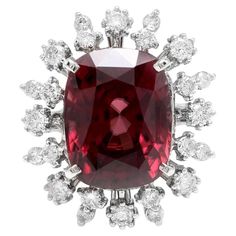 13.90 Carats Natural Red Zircon and Diamond 14K Solid White Gold Ring Suggested Replacement Value: Approx. $9,500.00 Total Natural Oval Cut Zircon Weight is: Approx. 13.00 Carats Zircon Measures: Approx. 13.00 x 10.00mm Natural Round Diamonds Weight: Approx. 0.90 Carats (color G-H / Clarity SI1-SI2) Ring size: 7 (free re-sizing available) Ring total weight: Approx. 7.8 grams Disclaimer: all weights, measurements and colors are approximate and may vary slightly from the listed dimensions or as se Zircon Jewelry, Royal Jewelry, Jewelry Outfit, White Gold Ring, Natural Red, Jewelry Designs, White Gold Rings, Cocktail Rings, Oval Cut