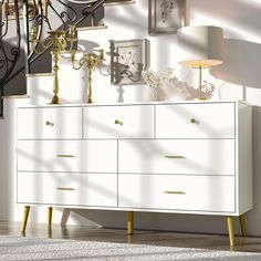 a white dresser sitting next to a stair case