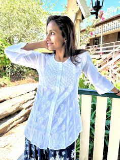 Theigh length tunic /Kurta with full front button opening is one of the gorgeous attire for warm weather. Airy and lightweight companion for a hot summer day. This beautiful Hand embroidered tunic/top is ideal for any functions/parties. If you want a classic look then pair it with leggings, skinny jeans, capri. This is a contemporary reflection of traditional Indian Chikan embroidered ethics which had originated centuries ago in Lucknow. Chikansazi being the exquisite needlework of fine and deli Spring Embroidered Kurta With 3/4 Sleeves, Spring Kurta With Floral Embroidery And 3/4 Sleeves, Bohemian Tunic For Daywear, Summer Long Sleeve Chikankari Embroidered Top, Summer Tunic With 3/4 Sleeves For Daywear, Summer Long Sleeve Blouse With Chikankari Embroidery, Summer Long Sleeve Top With Chikankari Embroidery, Summer Long Sleeve Chikankari Embroidery Blouse, Traditional Summer Tops With 3/4 Sleeves