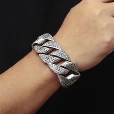 Constructed with a variety of textured pieces, this chunky chain bracelet offers a dynamic look that's ideal for anyone looking for a modern, hip-hop jewelry accessory. The durable stainless steel material guarantees longevity. Stainless Steel Color: Silver / Old Silver / Gold Chain Length 8.5-inches = 21.5 cm Chain Width 31 mm = 1.22047-inches Caring for necklace tips Avoid contact with chemicals like perfume, detergent & lotion. Avoid exercise/bathing while wearing. Clean with a soft cloth. Pa Modern Silver Chain Bracelet For Streetwear, Trendy Silver Chain Bracelet For Streetwear, Stainless Steel Cuban Link Bracelet With Chunky Chain, Trendy Silver Bracelet For Streetwear, Trendy Silver Bracelets For Streetwear, Metal Cuban Link Bracelet For Streetwear, Adjustable Chain Bracelets For Streetwear, Adjustable Silver Bracelet For Streetwear, Silver Metal Bangle Wristband