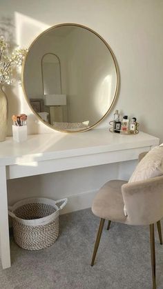 a white desk topped with a mirror and a chair