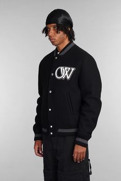 Bomber in black wool, bomber collar, long sleeves, closure with pressure buttons, logo patch on front, back embroidered logo, welt pockets, ribbed cuffs and bottom, 75% virgin wool, 25% polyamide, Made in ItalyGender: MenMaterial: WOOLColor: BlackMade in: ITProduct ID: 403976_OMEH053C99FAB002*Import tax/duty will be calculated at checkout (If applicable) Wool Varsity Jacket With Embroidered Logo For Streetwear, Black Varsity Jacket With Button Closure For College, Black Varsity Jacket For College With Button Closure, Black Crew Neck Outerwear For Work, Fitted Wool Varsity Jacket, Classic Wool Varsity Jacket With Baseball Collar, Wool Varsity Jacket With Embroidered Logo, Classic Wool Varsity Jacket For Winter, Black Long Sleeve Varsity Jacket For Work