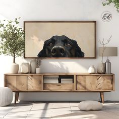 a painting of a dog's face on a wall above a wooden entertainment center