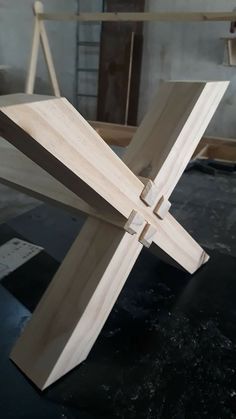 a wooden cross sitting on top of a table