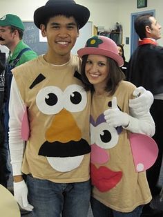 a man and woman dressed up as sesame street characters