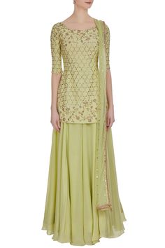 A crepe silk kurta and sharara set is hand embroidered with glimmering dabka, pearl and kundan work, along with shiny muakish work. The set comes with an embroidered dupatta that showcases a hand-made border.
Kurta with sharara pants and embroidered border dupatta
Hand work -Mukaish, Dabka, Kundan
Badla machine embroidery - Aza Fashions Reception Straight Kurta Palazzo Set In Chinon, Pista Green Straight Kurta Sets For Reception, Chinon Palazzo Set For Reception With Straight Kurta, Reception Palazzo Set With Straight Kurta In Georgette, Georgette Sharara For Reception In Transitional Season, Pista Green Palazzo Set With Dabka Work In Georgette, Silk Sharara With Mirror Work And Straight Kurta, Pista Green Georgette Palazzo Set With Zari Work, Transitional Georgette Palazzo Set For Reception