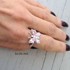 Pink CZ butterfly silver ring, clear - butterfly ring, silver ring, promise ring - 925 sterling silver Height: 16.0mm Width: 17.0mm Shank Width: 1.7mm Stone Material: Pink and White Cubic Zirconia Center Stone Size: 7.0mm x 5.0mm & 6.0mm x 4.0mm Stone Shape: Pear and Round Center Stone Carat Weight: 0.71 ct. & 0.39 ct. Number of CZ Stones: 8 Stone Setting: Prong Metal: 925 Sterling Silver Plating: Rhodium Finish: High Polish simply stunning. High Polished, solid 925 sterling silver. Rhodium plat Butterfly Charm Ring For Anniversary, Butterfly-shaped White Gold Jewelry For Wedding, Elegant Butterfly Ring Gift, White Gold Butterfly Jewelry For Wedding, Fine Jewelry Butterfly Shape For Wedding, Butterfly Shaped White Gold Ring For Formal Occasions, Fine Jewelry Butterfly Piece For Wedding, Elegant Anniversary Rings With Butterfly Charm, White Gold Butterfly Ring For Formal Occasions