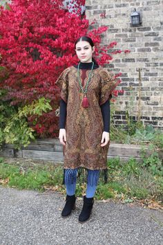 "❥Pashmina Ethnic Print Tunic, hand made using a large scarf/wrap ❥Material is thick and warm for fall/winter ❥open at the sides from hip down for easily slipping on and off ❥Beautiful Indian beaded Print ❥inspired by boho hippie fashion ❥fits size small/medium/large ❥measurements bust fits up to 42\" Hips fit up to 44\" Sleeve is open model is size small medium, this will also fit a large (i am 42\" bust and 44\" hip and this fits me loosely as well :) ❥shipping -All shipping within CANADA and Traditional Fringed Poncho Shawl, Fall Festival Poncho Shawl, Bohemian Shawl Poncho For Fall, Fall Festival Shawl Poncho, Traditional Fringe Poncho For Fall, Traditional Fall Poncho With Fringe, Traditional One Size Poncho For Fall, Brown Bohemian Poncho For Festivals, Bohemian Brown Poncho For Festivals