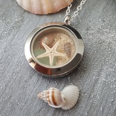 Aloha! Bring a little bit of beach and Hawaii everywhere you go with this memory locket. This is a stainless steel pendant with a tarnish resistance silver plated chain necklace. The chain is a 20 inches long (can be customized from 30 inches down to any length if you leave a note with your order) with a lobster claw catch. Free gift wrap and gift message with every order. Perfect for you or as a gift to family members or friends. Please see my other items in my store, There are matching necklac Beachy Sand-colored Jewelry For Gift, Beachy Sand-colored Jewelry Gift, Silver Coastal Jewelry Gift, Coastal Style Silver Jewelry For Gifts, Coastal Style Silver Jewelry Gift, Nickel Free Starfish Jewelry In Ocean-inspired Style, Nickel-free Starfish Jewelry With Ocean-inspired Style, Ocean-inspired Starfish Nickel-free Jewelry, Nickel-free Starfish Shaped Ocean-inspired Jewelry