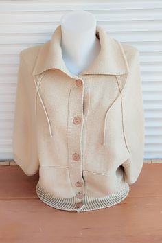 Vintage beige cardigan. Wool sweater .Pullover women's knitwear. Beige jacket with buttons, two pockets, high collar. Raglan sleeve 3/4 length. Back length - 20,47" or 52 cm. Distance from armhole to armhole -  18,89" or 48 cm. Good vintage condition. Care instructions: hand wash in cold water with mild soap, lay flat to dry.                                                                                                                                  Ready to ship. Beige Buttoned Sweater Coat With Long Sleeves, Beige Long Sleeve Sweater Coat With Buttons, Oversized Beige Cardigan With Button Closure, Beige Long Sleeve Sweater Coat With Button Closure, Beige Button-up Winter Sweater, Winter Beige Buttoned Cardigan, Beige Winter Cardigan With Buttons, Cream Polo Sweater For Workwear In Fall, Cream Polo Sweater For Fall Workwear