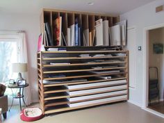 a book shelf filled with lots of books in a living room