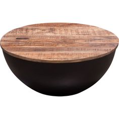 a wooden and black bowl sitting on top of a table