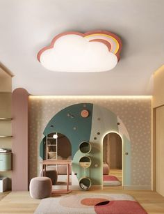 a child's bedroom with a cloud shaped ceiling light