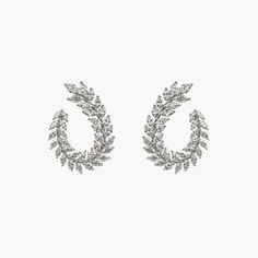 Earrings featuring 6.46 carats of marquise cut diamonds handcrafted in 18K white gold. Two rows of stones are perfectly set to form an elegant garland of laurel leaves, wrapping around the earlobe with an open-ended design. With its dynamic shapes and light-catching design details, this unique silhouette adds unmistakable elegance to any look. Dynamic Shapes, Laurel Leaves, Marquise Cut Diamond, Open Ended, Marquise Cut, Best Brand, Design Details, Necklace Lengths, Diamond Cuts