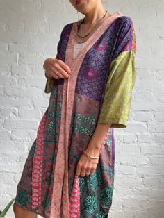 "This is one of a kind upcycled silk patchwork kimono robe, midi length super comfy flowey and light summer cover up True boho street style Perfect for many occasions parties or around the house made in free size with easy wrap tie closing perfect on its own or layered over with jeans and t shirt length 38\" more available at https://www.etsy.com/shop/AltheaStores? Thank you for looking" Pink Patchwork Outerwear For Summer, Summer Pink Patchwork Outerwear, Vintage Multicolor Patchwork Kimono, Spring Patchwork Kaftan, Summer Long Patchwork Outerwear, Long Patchwork Summer Outerwear, Spring Silk Robe With Open Front, Spring Festival Wrap Robe, Patchwork Kimono Sleeve Outerwear For Festival