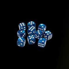 six blue and white dice on a black background