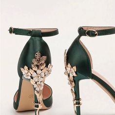 a pair of green high heels with flowers on them