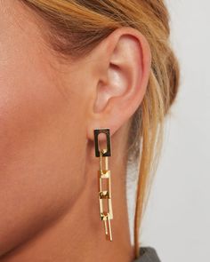 An essential addition to your jewerly rotation: meet the Hugo Chain Link Drop Earrings. This pretty pair is perfect for casual and formal outfits alike, with linked rectangle open chains that dangle beautifully from the ear. Finished with a push backing. FINAL SALE. Dimensions: 2.25" L x 0.3" W Material: Gold-plated stainless steel Closure: Post backing Rectangle chain link detail Trendy Rectangular Link Jewelry For Formal Occasions, Trendy Formal Jewelry With Rectangular Links, Trendy Rectangular Linked Jewelry For Formal Occasions, Trendy Rectangular Gold Chain Jewelry, Trendy Rectangular Metal Jewelry, Trendy Formal Linear Earrings, Chic Rectangular Metal Jewelry, Metal Earrings With Rectangular Links, Rectangular Jewelry With Adjustable Chain For Party