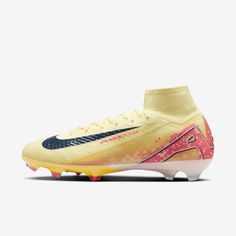 the nike superfly fg soccer cleat is shown in yellow and blue