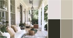 the front porch is decorated with white furniture and green plants, along with neutral colors