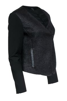 Grab this edgy jacket for a touch of rebellion from Tibi! Perfect for the office, the weekend and beyond, the is the perfect piece to wear with a black jeans, slacks or your favorite cocktail dress. Size 6 48% Polyester, 47% Viscose, 5% Elastane Front zipper closure Moto-style with deep neckline Woven texture Exterior pockets with leather trim Waist 36" Sleeve 24.5" Shoulder to hem 23" Edgy Winter Business Outerwear, Edgy Business Winter Outerwear, Sleek Winter Biker Jacket, Sleek Winter Biker Jacket For Office, Chic Black Biker Jacket For Office, Chic Winter Biker Jacket For Workwear, Sleek Biker Jacket For Office In Fall, Modern Black Biker Jacket For Formal Occasions, Modern Biker Jacket For Spring Workwear