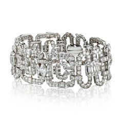 An eye-catching and wearable heirloom! The attention to detail and the dramatic design is what sets this work of art apart from the rest. Staggering 28.00 carats of multi-shaped diamonds, F/G color VS clarity are linked together by common art deco shapes in this bracelet. Carefully assembled in Platinum measuring 7.25 inches in length and about 25mm wide. Details: Diamond Link 1930'sTotal Carat Weight: 28.00Measurements: 7.25 inches.Metal Type: PlatinumMetal Weight: 78.1 gr.Condition: Vintage. G Art Deco Diamond Bracelet, Lavish Lifestyle, Art Deco Shapes, Diamond Cuff Bracelet, Art Deco Diamond, Antique Diamond, Vintage Designer, Rare Antique, Diamond Gemstone