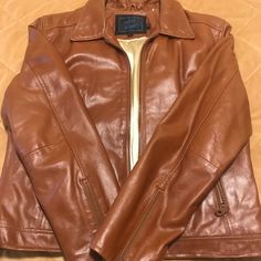 Beautiful Cognac Color With Gold Liner. Amazing Condition. Has Small Picks Near Inside Pockets As Can Be Seen In Picture. Size Medium. Steve Madden Jacket, Gold Liner, Cognac Color, Leather Jackets, Cognac, Inside Pocket, Steve Madden, Jackets For Women, Jackets & Coats