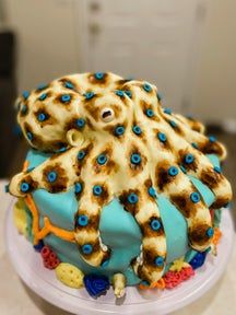 there is a cake decorated with an octopus on it